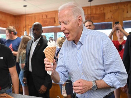 US President Joe Biden eats ice cream at Moomers Homemade Ice Cream in Traverse City, Mich