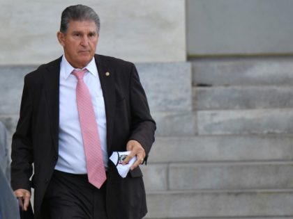 US Senator Joe Manchin (D-WV) leaves the U.S. Capitol in Washington, DC, on October 28, 2021. - US President Joe Biden announced a "historic" framework Thursday for spending $3 trillion on America's social safety net and crumbling infrastructure, but his claim to be on the cusp of a major political …
