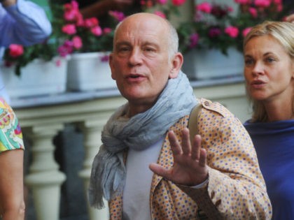U.S. actor, director and producer John Malkovich, centre, arrives at the Grandhotel Pupp in Karlovy Vary, Czech Republic, as the guest of the 46th International Film Festival on Wednesday, July 6, 2011. On Thursday, Malkovich will hold a fashion show for Technobohemian, his “nontraditional” men’s clothing line, using top Czech …