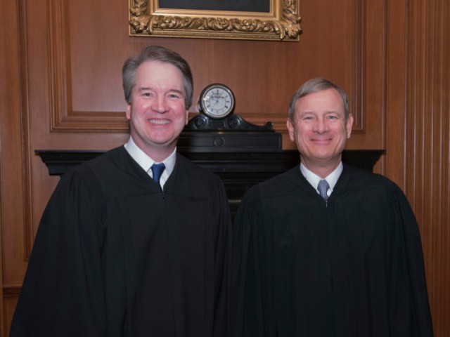 This image provided by the U.S. Supreme Court show Associate Justice Brett M. Kavanaugh, left and Chief Justice John G. Roberts, Jr. in the Justices' Conference Room before a investiture ceremony Thursday, Nov. 8, 2018, at the Supreme Court in Washington. (Fred Schilling/Collection of the Supreme Court of the United States via AP)