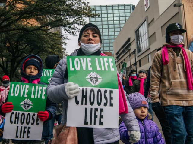 DALLAS, TEXAS - JANUARY 15: Pro-life demonstrators march during the "Right To Life" rally on January 15, 2022 in Dallas, Texas. The Catholic Pro-Life Community, Texans for Life Coalition, the Catholic Diocese of Dallas, and the Diocese of Fort Worth North hosted the Texas March for Life rally where people …