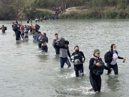 A large group of mostly Venezuelan migrants stream across the border near Eagle Pass, Texas. (Photo: U.S. Customs and Border Protection)
