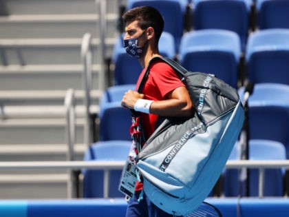 Novak Djokovic of Team Serbia walks out prior to a practice session at Ariake Tennis Park