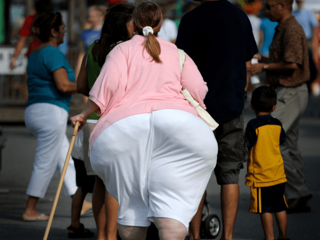 An overweight woman walks at the 61st Montgomery County Agricultural Fair on August 19, 2009 in Gaithersburg, Maryland. At USD 150 billion, the US medical system spends around twice as much treating preventable health conditions caused by obesity than it does on cancer, Health Secretary Kathleen Sebelius said. Two-thirds of …