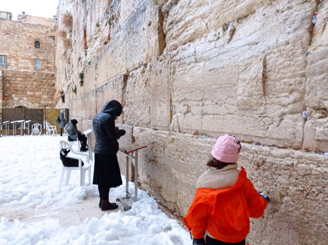 A snowstorm hit Jerusalem overnight Wednesday, prompting revellers and schoolchildren to take to the streets and dance it out in a holy winter wonderland.