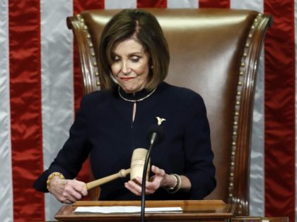 House Speaker Nancy Pelosi of California holds the gavel after announcing the passage of the second article of impeachment, obstruction of Congress, against President Donald Trump by the House of Representatives at the Capitol in Washington, Wednesday, Dec. 18, 2019.