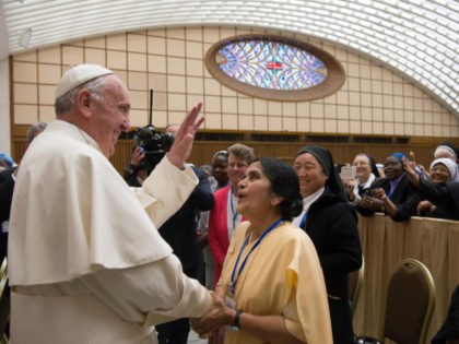 Pope Francis greets participants in a special audience with members of the International U