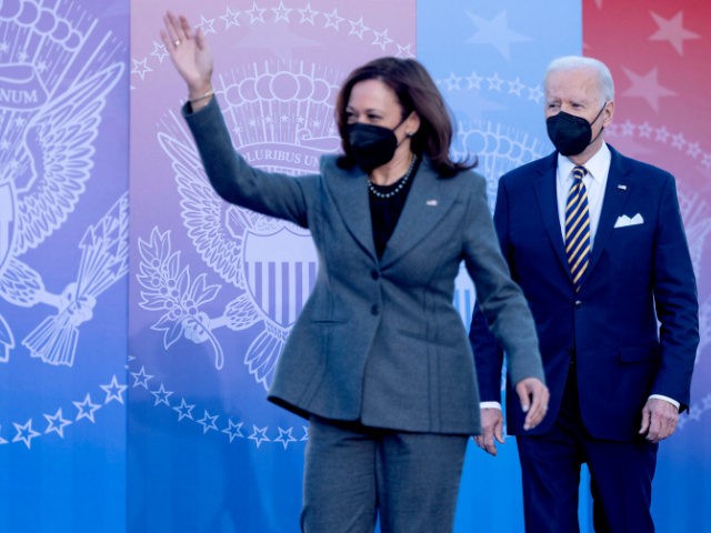 Vice President Kamala Harris (L) and President Joe Biden arrive to speak about the constit