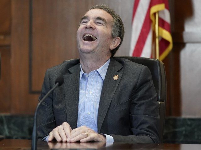 Virginia Gov. Ralph Northam laughs during an interview in his conference room at the Capit