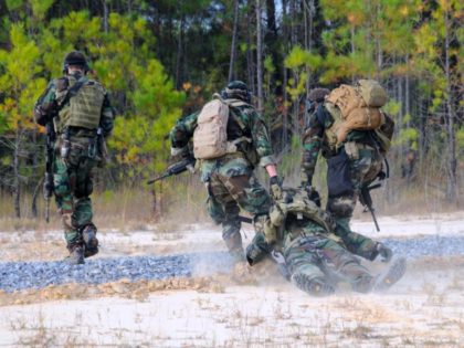 STENNIS SPACE CENTER, MS - OCTOBER 25: (EDITORS NOTE: Image has been reviewed by U.S. Military prior to transmission.) In this handout provided by the U.S. Navy, Navy SEALs simulate the evacuation of an injured teammate during immediate action drills October 25, 2010, at the John C. Stennis Space Center, …