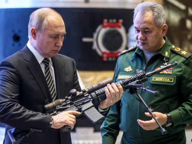 Russian President Vladimir Putin, left, and Russian Defense Minister Sergei Shoigu visit an military exhibition after attending an extended meeting of the Russian Defense Ministry Board at the National Defense Control Center in Moscow, Russia, Tuesday, Dec. 21, 2021. The Russian president on Tuesday reiterated the demand for guarantees from …