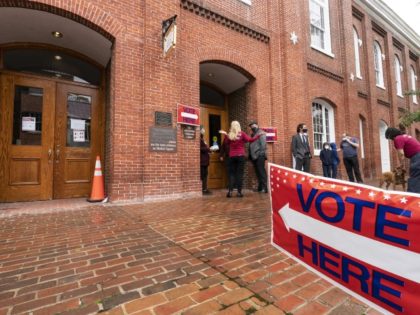 FILE - Voters arrive to cast the their ballots on Election Day at City Hall, Tuesday, Nov. 2, 2021, in Alexandria, Va.