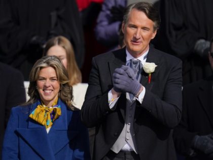 Gov. elect Glenn Youngkin with wife Suzanne Youngkin wave to the crowd before his inauguration ceremony, Saturday, Jan. 15, 2022, in Richmond, Va.