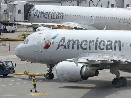 American Airlines passenger jets prepare for departure, Wednesday, July 21, 2021.