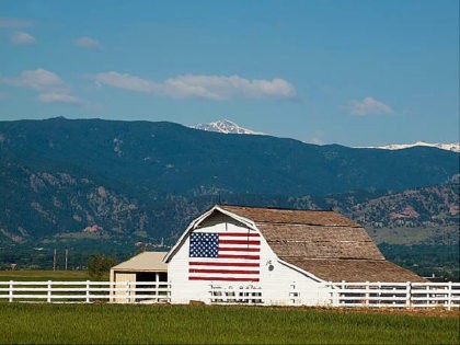 White barn with painted American Flag in Colorado.