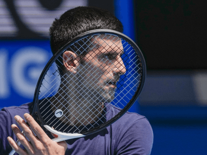Defending champion Serbia's Novak Djokovic practices ahead of the Australian Open tennis championship in Melbourne, Australia, Jan. 12, 2022. Weary after two years of some of the harshest COVID-19 border restrictions in the world, many Australians wanted Djokovic kicked out of their country for traveling to the tennis tournament without …