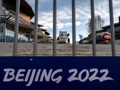 ZHANGJIAKOU, CHINA - JANUARY 02: The mascots for the Beijing 2022 Winter Olympics are seen behind a fence in one of the villages for the games before the area closed to visitors, on January 2, 2022 in Chongli county, Zhangjiakou, Hebei province, northern China. The area, which will host ski …