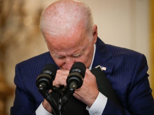 WASHINGTON, DC - AUGUST 26: U.S. President Joe Biden pauses while listening to a question from a reporter about the situation in Afghanistan in the East Room of the White House on August 26, 2021 in Washington, DC. At least 12 American service members were killed on Thursday by suicide …