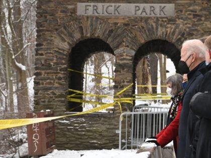 US President Joe Biden visits the scene of the Forbes Avenue Bridge collapse over Fern Hollow Creek in Frick Park in Pittsburgh, Pennsylvania, January 28, 2022. - The bridge collapse provided a symbolic backdrop for President Biden's trip to the city to tout his $1 trillion infrastructure plan -- and …
