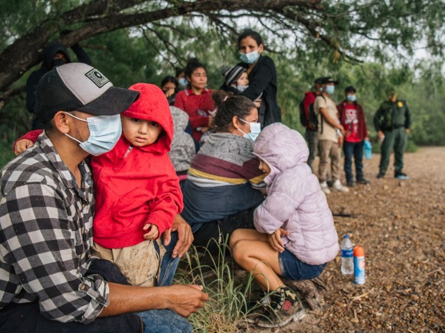 LA JOYA, TEXAS - JUNE 16: Immigrants seeking asylum wait to be processed by border patrol after crossing into the U.S. on June 16, 2021 in La Joya, Texas. A surge of mostly Central American immigrants crossing into the United States has challenged U.S. immigration agencies along the U.S. Southern border.