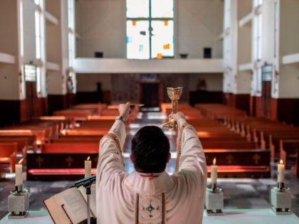 Catholic priest Arturo Correa celebrates Easter Mass amid the Coronavirus pandemic at the