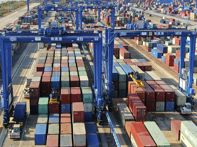 A container port is pictured in Nantong in eastern China's Jiangsu province Monday, Dec. 6, 2021. China's exports rose by double digits in November but growth declined, while imports accelerated in a sign of stronger domestic demand. (Chinatopix via AP)