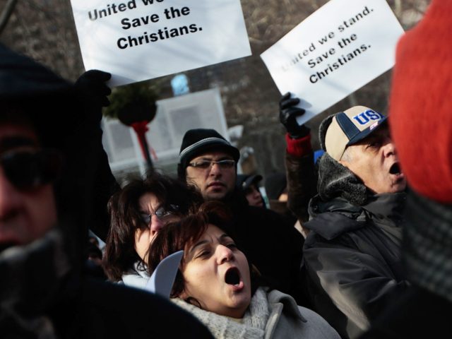 NEW YORK, NY - DECEMBER 14: A supporter of Egypt's Coptic Christian community shouts during a protest near the United Nations against the Egyptian government's treatment of its Christian minority December 14, 2010 in New York City. Coptic Christians are one of the oldest Christian populations in the world and …