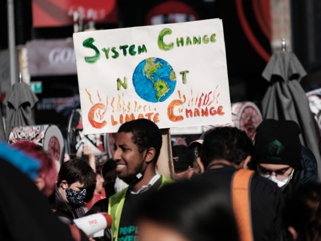 NEW YORK, NEW YORK - NOVEMBER 13: Hundreds of climate protesters walk from Times Square to New York Governor Kathy Hochul’s office to demand more action against climate change on on November 13, 2021 in New York City. The protesters, representing a cross section of environmental groups, are demanding that …