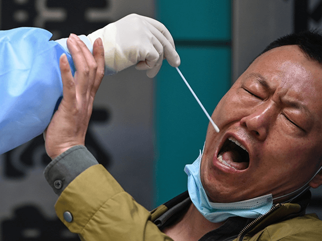 This combination of images shows a man being tested for the COVID-19 novel coronavirus (top) as a medical worker takes a swab sample and then his reaction (bottom) from the text in Wuhan in China's central Hubei province on April 16, 2020. - China has largely brought the coronavirus under …