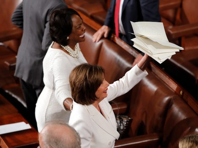 House Speaker Nancy Pelosi of Calif., holds the copy of President Donald Trump's State of the Union address she tore up after he delivered it to a joint session of Congress on Capitol Hill in Washington, Tuesday, Feb. 4, 2020. At left is Rep. Val Demings, D-Fla. (AP Photo/J. Scott …