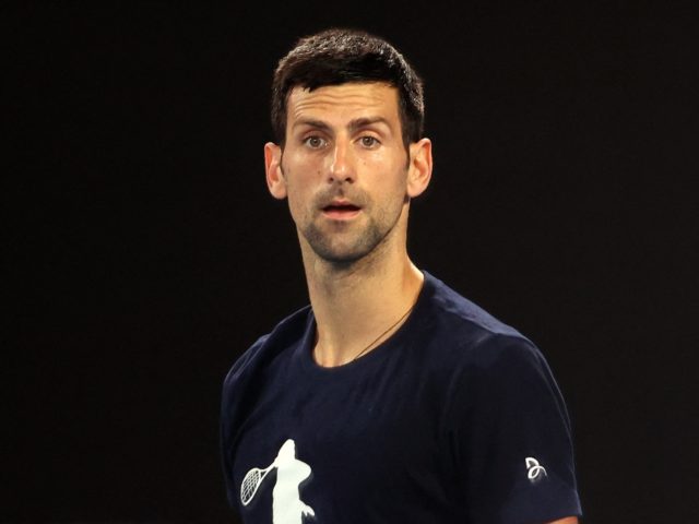 Novak Djokovic of Serbia attends a practice session ahead of the Australian Open tennis tournament in Melbourne on January 14, 2022. - --IMAGE RESTRICTED TO EDITORIAL USE - NO COMMERCIAL USE-- (Photo by MARTIN KEEP / AFP) / --IMAGE RESTRICTED TO EDITORIAL USE - NO COMMERCIAL USE-- (Photo by MARTIN …