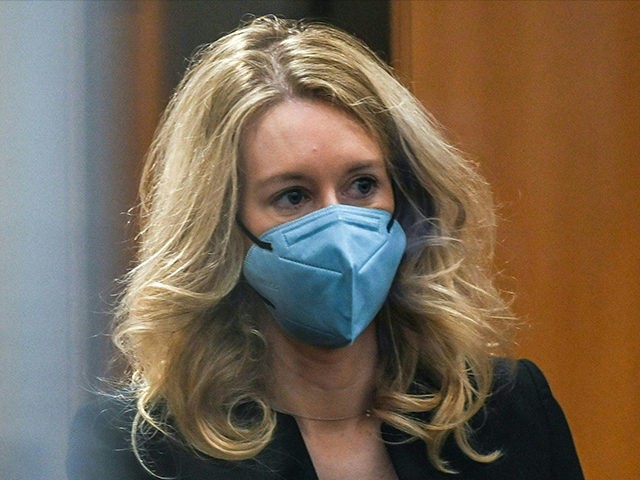 Former Theranos founder and CEO Elizabeth Holmes goes through security after arriving for court at the Robert F. Peckham Federal Building on November 22, 2021 in San Jose, California. - Holmes is facing charges of conspiracy and wire fraud for allegedly engaging in a multimillion-dollar scheme to defraud investors with …
