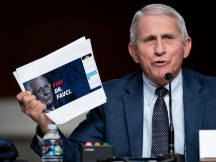 Dr. Anthony Fauci, White House Chief Medical Advisor and Director of the NIAID, shows a screen grab of a campaign website while answering questions from Senator Rand Paul (R-Ky.) during a Senate Health, Education, Labor, and Pensions Committee hearing to examine the federal response to Covid-19 and new emerging variants …
