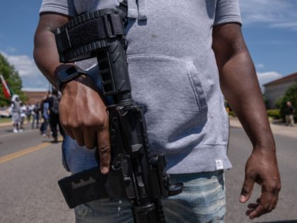 Black gun owners march to the governor's mansion in Oklahoma City, Oklahoma on June 20,2020 during a pro-second amendment rally on the same day that US President Donald Trump's holds his first political rally in months amid the coronavirus pandemic. (Photo by SETH HERALD / AFP) (Photo by SETH HERALD/AFP …