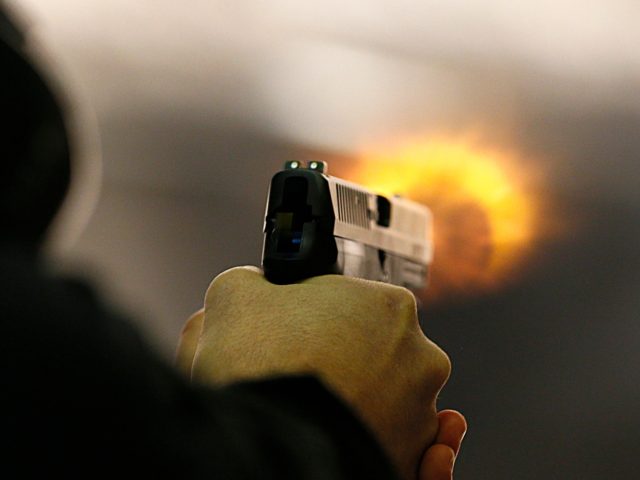 SALT LAKE CITY, UT - JANUARY 15: Brett Nielsen fires an Glock handgun at the "Get Some Guns & Ammo" shooting range on January 15, 2013 in Salt Lake City, Utah. Lawmakers are calling for tougher gun legislation after recent mass shootings at an Aurora, Colorado movie theater and at …