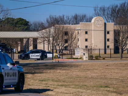 COLLEYVILLE, TEXAS - JANUARY 16: Law enforcement vehicles sit in front of the Congregation