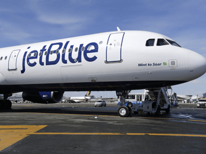 This March 16, 2017, file photo, shows a JetBlue airplane at John F. Kennedy International Airport in New York. JetBlue Airways is considering whether to keep its headquarters in New York or move to Florida. The airline has been based in the Queens neighborhood of Long Island City since it …