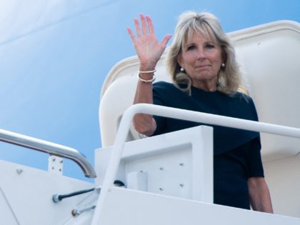 US President Joe Biden and First Lady Jill Biden board Air Force One prior to their departure from Joint Base Andrews in Maryland, July 1, 2021, as they travel to Surfside, Florida, to visit with families of victims of the 12-story Champlain Towers South condo building collapse. (Photo by SAUL …