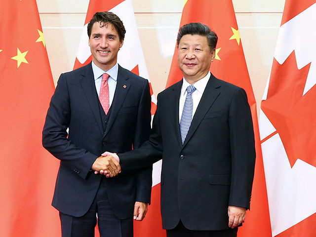 Chinese President Xi Jinping (R) shakes hands with Canadian Premier Justin Trudeau (L) ahead of their meeting at the Diaoyutai State Guesthouse in Beijing on August 31, 2016. Trudeau is on a one-week visit to China from August 30 to September 6 and will also attend the G20 Summit in …
