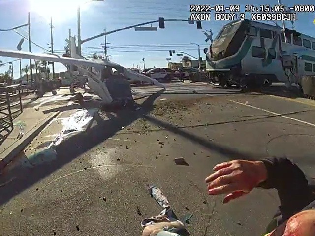 Watch: Police Rescue Pilot Moments Before Train Plows into Crashed Plane thumbnail