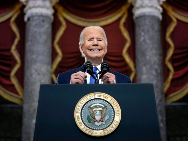 TOPSHOT - US President Joe Biden speaks at the US Capitol on January 6, 2022, to mark the