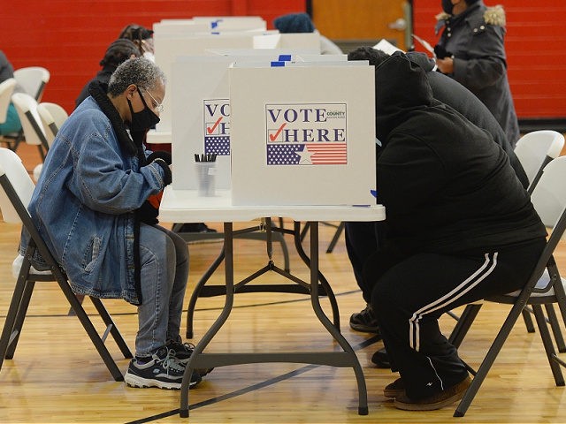 ST LOUIS, MO - NOVEMBER 03: Voters cast their ballots on November 3, 2020 at Jennings Senior High School in St Louis, Missouri. After a record-breaking early voting turnout, Americans head to the polls on the last day to cast their vote for incumbent U.S. President Donald Trump or Democratic …