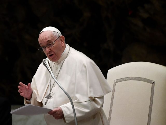 Pope Francis speaks to the Vatican employees during an audience for the Christmas greeting