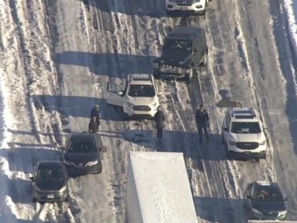 Motorists sit stranded on Interstate 95 near Fredericksburg, Va, on Tuesday, Jan. 4, 2022. Hundreds of motorists were stranded all night in snow and freezing temperatures along a 50-mile stretch of Interstate 95 after a crash involving six tractor-trailers in Virginia, where authorities were struggling Tuesday to reach them. (WJLA …