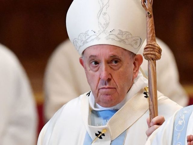 Pope Francis leaves at the end of the New Year's day mass in St. Peter's Basilica at the V