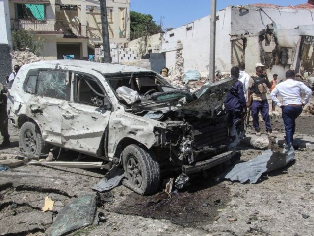 TOPSHOT - A general view of the scene of a car-bomb explosion in Mogadishu on January 12,