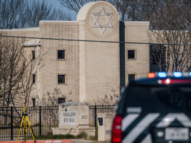 COLLEYVILLE, TEXAS - JANUARY 16: A law enforcement vehicle sits in front of the Congregation Beth Israel synagogue on January 16, 2022 in Colleyville, Texas. All four people who were held hostage at the Congregation Beth Israel synagogue have been safely released after more than 10 hours of being held …