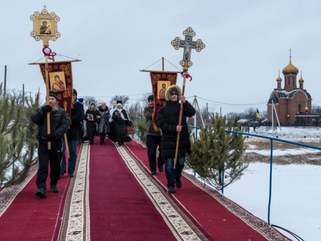 KARLIVKA, UKRAINE - JANUARY 19: A religious procession outside the Holy Epiphany Church on