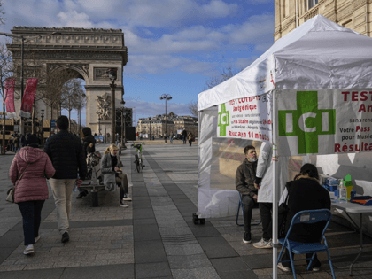 A man gets a nasal swap at a mobile COVID-19 testing site at the Champs Elysees avenue in Paris, Wednesday, Jan. 5, 2022. France is allowing health workers who are infected with the coronavirus but have few or no symptoms to keep treating patients rather than self-isolate, an extraordinary stop-gap …