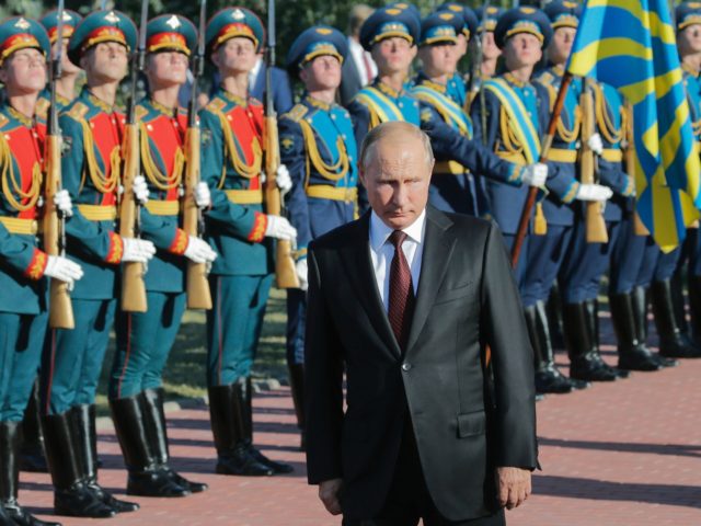 Russian President Vladimir Putin reviews the guard of honour during a memorial ceremony, to mark the 75th anniversary of the battle of Kursk, in Kursk, southern of Moscow, on August 23, 2018. - Putin attends a ceremony marking the 75th anniversary of the battle of Kursk in which the Soviet …